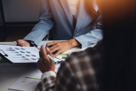 Team of business people working together in the meeting room office, teamwork background charts and graphs banner, double exposure successful teamwork,business planning concept.の写真素材