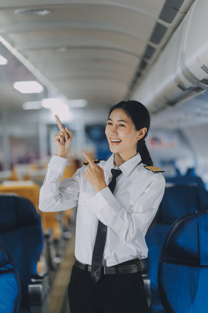 Portrait of a trained airplane captain in uniform preparing to fly, event planning in airplane.の写真素材