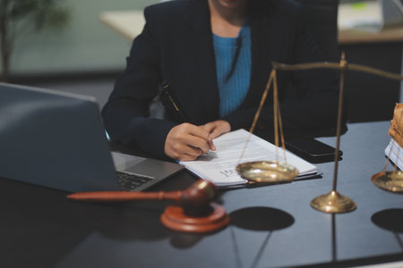 female business woman lawyers working at the law firms. Judge gavel with scales of justice. Legal law, lawyer, documents, advice and justice concept.の写真素材