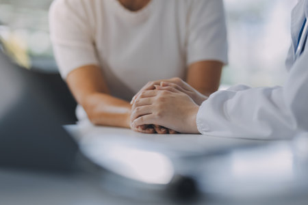 doctor holding patient's hand Cheer and encourage while checking your health. Trust your health and mind.の写真素材