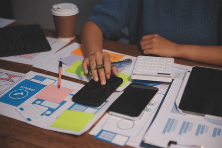 The designer team is designing the uxui system to make the uxui system work well on new phones and support system updates. Website development concept UI UX front end designerの写真素材