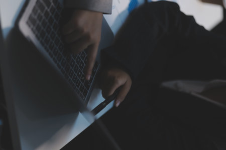 Close up of Business team analyzing income charts and graphs with modern laptop computer. Business analysis and strategy concept.の写真素材