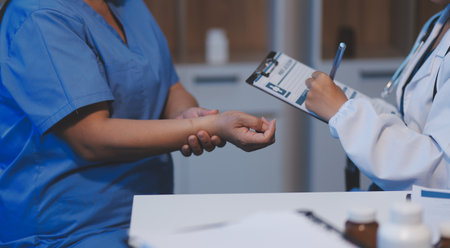 Charming female doctor giving advice to a female patient.の写真素材