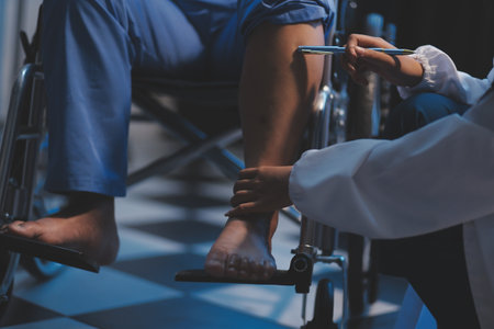 Asian young professional successful friendly female nurse in blue hospital uniform helping supporting physical therapy senior old pensioner unhealthy injury woman patient walking via four legs walker.の写真素材