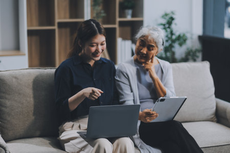 Asian elderly women and friend using social media and living room. Video streaming, happiness and...