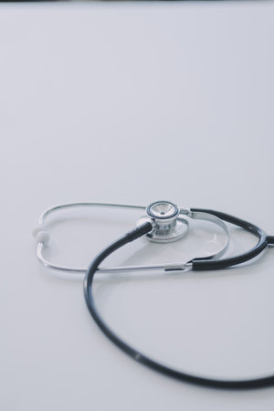 Health care billing statement with stethoscope, bottle of medicine for doctor's work in medical...