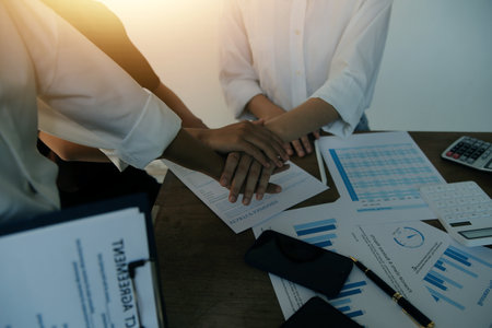 Leaders of business organizations join hands after the meeting is complete. Business partner meeting ideas.の写真素材