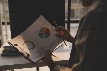 Team of business people working together in the meeting room office, teamwork background charts and graphs banner, double exposure successful teamwork,business planning concept.の写真素材