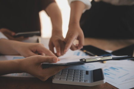 Business meetings to analyze investment strategies and brainstorm sales plans for a more profitable business.の写真素材