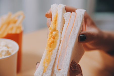 Asian healthy woman have breakfast with sandwich in morning