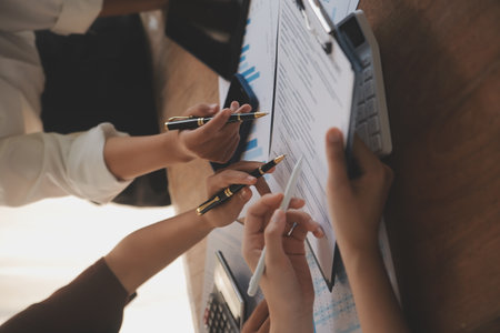 Business meetings to analyze investment strategies and brainstorm sales plans for a more profitable business.の写真素材