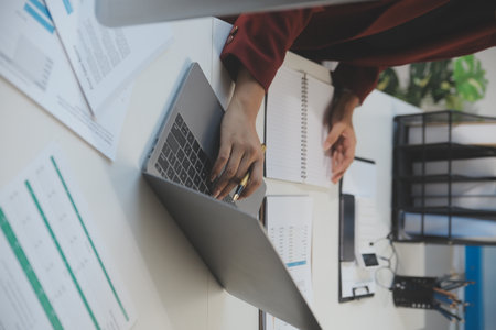 Cropped image of professional businesswoman working at her office via laptop, young female manager...