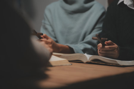 Christian group are praying to god with the bible and sharing the gospel. Concept of faith for god.の写真素材