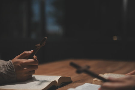 Christian group are praying to god with the bible and sharing the gospel. Concept of faith for god.