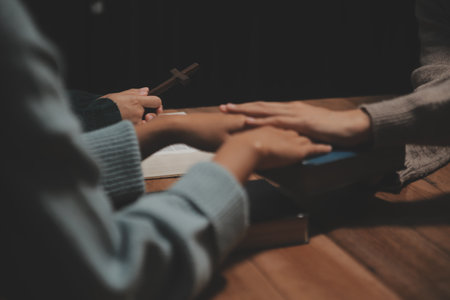 Christian group are praying to god with the bible and sharing the gospel. Concept of faith for god.