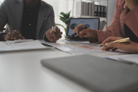 Close up of Business team analyzing income charts and graphs with modern laptop computer. Business analysis and strategy concept.の写真素材
