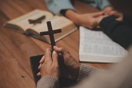 Christian group are praying to god with the bible and sharing the gospel. Concept of faith for god.の写真素材