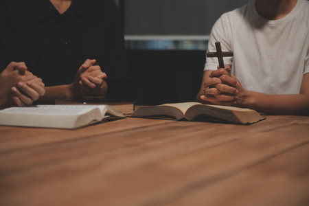 Christian group are praying to god with the bible and sharing the gospel. Concept of faith for god.の写真素材