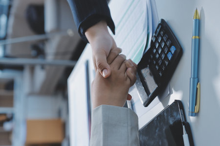 Business handshake for teamwork of business merger and acquisition,successful negotiate,hand shake,two businessman shake hand with partner to celebration partnership and business deal conceptの写真素材