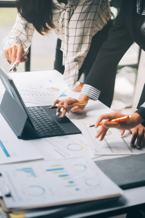 Fund managers team consultation and discuss about analysis Investment stock market at officeの写真素材