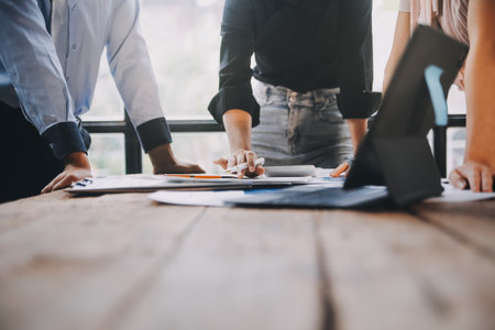 Fund managers team consultation and discuss about analysis Investment stock market at officeの写真素材