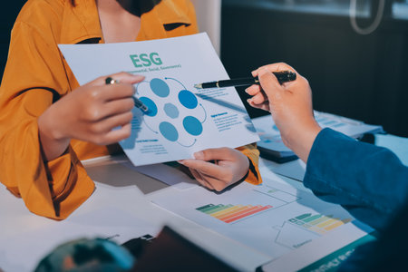 ESG environmental social governance display on laptop on eco-friendly company meeting with business people implementing environmental protection for clean and sustainable future ecology. Trailblazingの写真素材