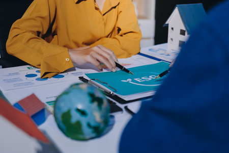 ESG environmental social governance display on laptop on eco-friendly company meeting with business people implementing environmental protection for clean and sustainable future ecology. Trailblazingの写真素材