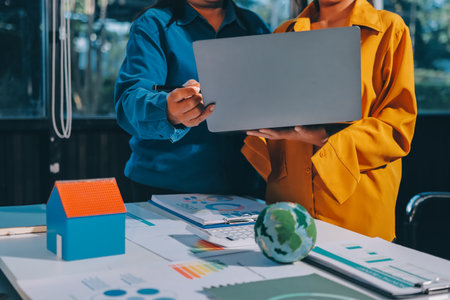 ESG environmental social governance display on laptop on eco-friendly company meeting with business people implementing environmental protection for clean and sustainable future ecology. Trailblazingの写真素材