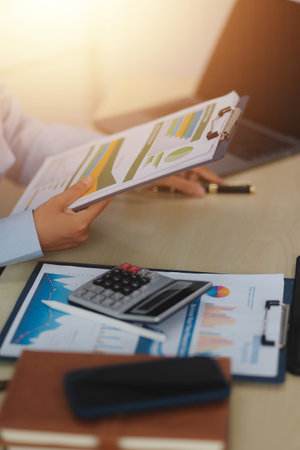 Business Documents, Auditor businesswoman checking searching document legal prepare paperwork or report for analysis TAX time,accountant Documents data contract partner deal in workplace officeの写真素材