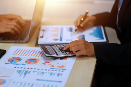 Business Documents, Auditor businesswoman checking searching document legal prepare paperwork or report for analysis TAX time,accountant Documents data contract partner deal in workplace officeの写真素材