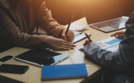 Workers discuss them at the company conferenceの写真素材