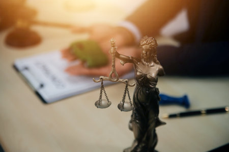 Judge gavel and miniature car symbolize auction or court case against driver who has accident and...