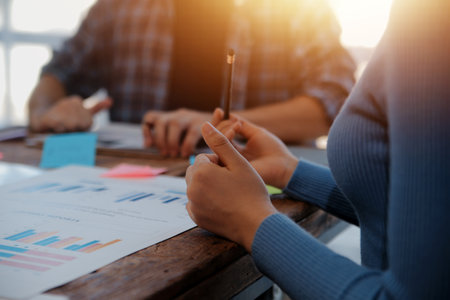 Team of business people working together in the meeting room office, teamwork background charts and graphs banner, double exposure successful teamwork,business planning concept.の写真素材