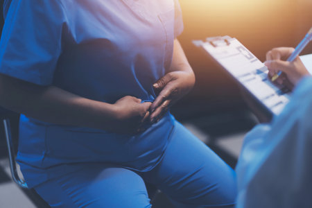 Charming female doctor giving advice to a female patient.
