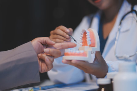 Dentist and patient discussion about planned dental treatment in dental clinic office, doctors talk and work. health care talk medical conference conceptの写真素材