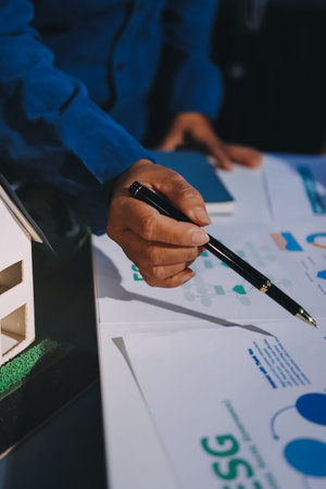 ESG environmental social governance display on laptop on eco-friendly company meeting with business people implementing environmental protection for clean and sustainable future ecology. Trailblazingの写真素材