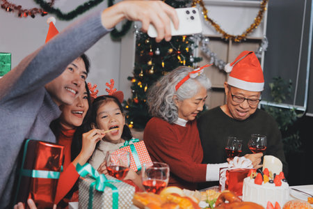 Happy family with gifts celebrating Christmas together