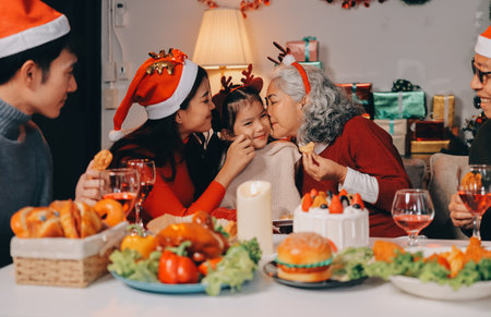 Happy multigeneration family enjoying in opening gifts on Christmas eve at home.の写真素材