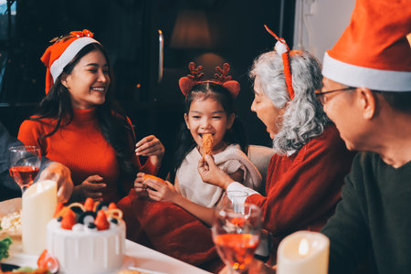 Happy multigeneration family enjoying in opening gifts on Christmas eve at home.の写真素材