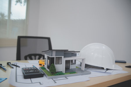 Architects, engineers, contractors working in the office with blueprints, inspection engineers Work analysis for architectural plan, construction project sketch, focus, business construction concept.の写真素材