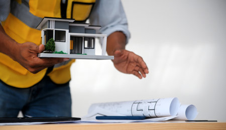 Image of engineer meeting for architectural project. working with partner and engineering tools on...