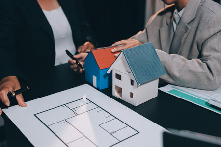 Close up Business people or Real Estate agent explain signing agreement for sale house to client. Property, Insurance, Broker concept.の写真素材