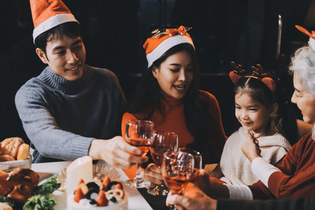 Happy multigeneration family enjoying in opening gifts on Christmas eve at home.の写真素材