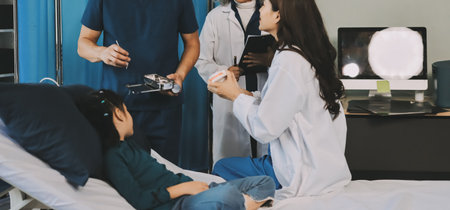 A team of doctors and nurses are working to treat a female patient in the patient's room.