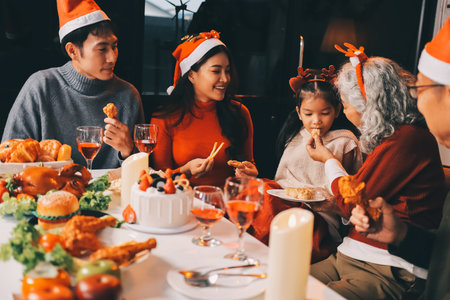 Happy multigeneration family enjoying in opening gifts on Christmas eve at home.の写真素材
