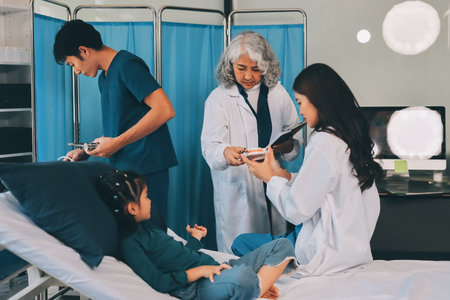 A team of doctors and nurses are working to treat a female patient in the patient's room.の写真素材