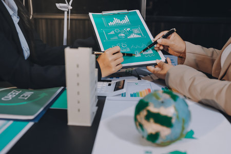 Carbon offset price report CO2 emission. Future growth Net zero waste in ESG ethical SME office protect climate change global warming social issues project. Group of asia people Eco friendly SDGs planの写真素材
