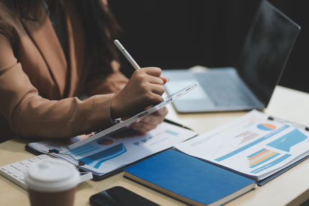 business documents businessman check legal document review Prepare documents or analysis reports, tax items, accounting documents, data contracts, office partner agreements.の写真素材