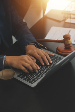 Law theme, gavel or mallet of the judge, lawyer enforcement officers, evidence-based cases taken into account in the court abount business, legislation.の写真素材