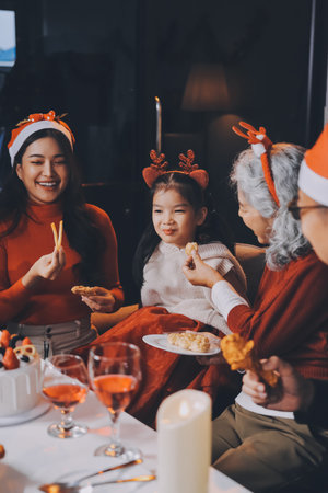 Happy multigeneration family enjoying in opening gifts on Christmas eve at home.の写真素材